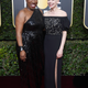 Tarana Burke (L) and Michelle Williams attend The 75th Annual Golden Globe Awards at The Beverly Hilton Hotel on January 7, 2018 in Beverly Hills, California.